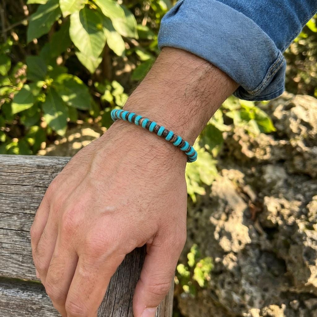 Men wearing turquoise and coconut shell bead bracelet outdoors