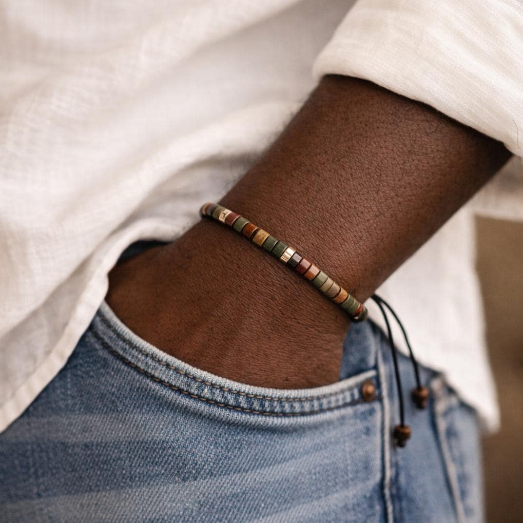 Men wearing earth tone stone bead bracelet with adjustable macrame cord